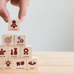 "Essential tools and resources for small business owners, including charts, laptops, and collaboration setups, symbolizing growth and success."